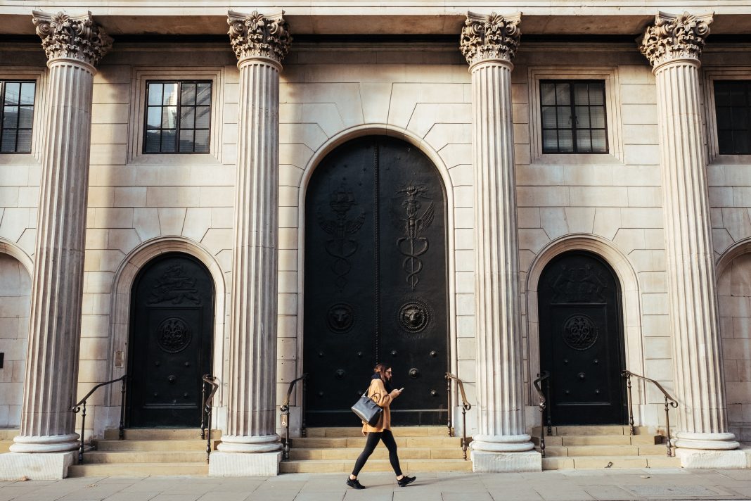 Woman walking in front of a building